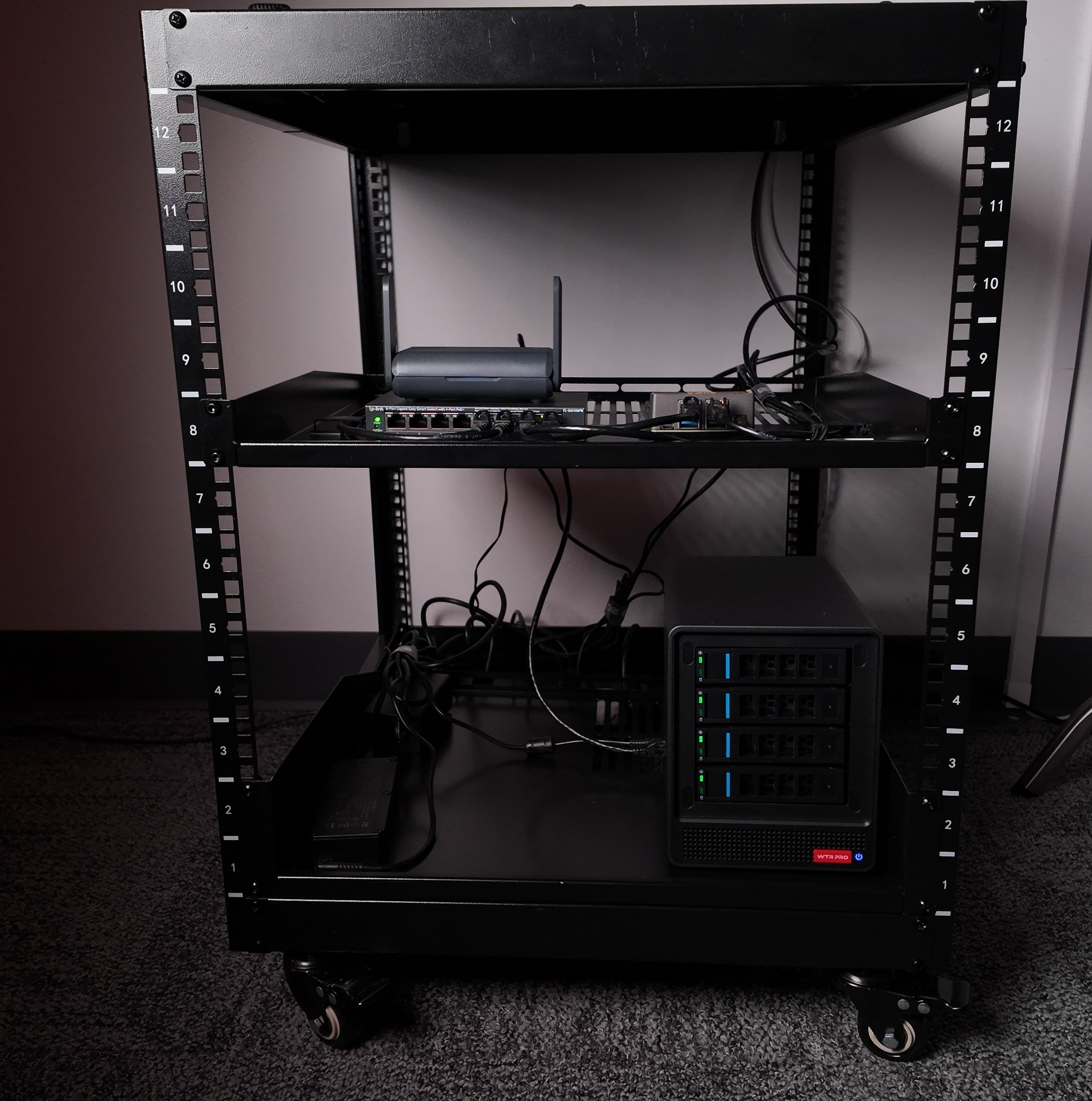 Home lab rack with router, switch, and storage server
